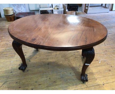 A 19thc dining table, the moulded top on cabriole supports with acanthus leaf knees and ball and claw feet terminating in cas