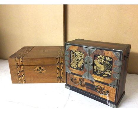 A Japanese parquetry table jewellery cabinet, the two hinged doors, both with lacquered panels depicting roosters, the interi