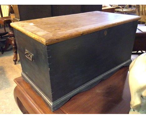 A 19thc blanket box, with painted exterior, the hinged lid above a recess with candle shelf above two drawers, on bracket fee