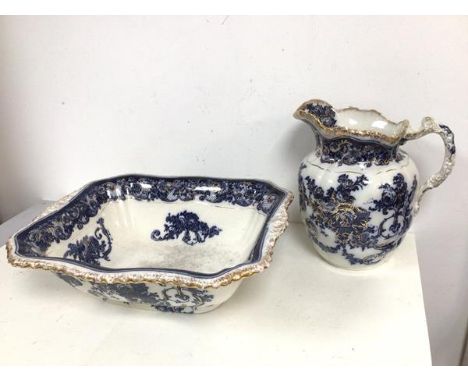 A Victorian wash basin and ewer with blue floral and gilt decoration, base of basin marked Rome with crown, SB &amp; S (13cm 