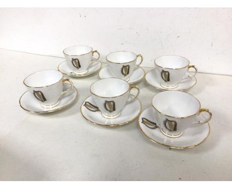 An Irish Royal Tara teaset including six cups and saucers (cup: 6.5cm x 10cm x 8cm), all with gilt and harp decoration