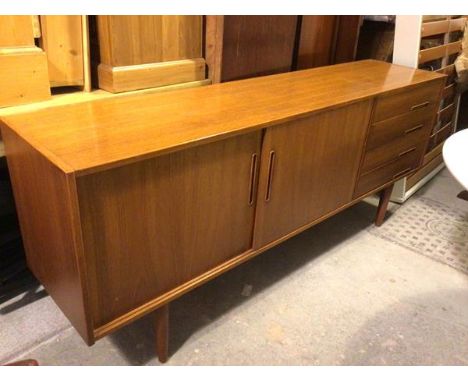 A mid century Troeds model Trento designed by Nils Jonsson, Swedish teak side cabinet, with two sliding doors and four drawer