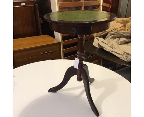 A Georgian style wine table with tooled leather circular top, fitted single frieze drawer, on turned tripod support  (56cm x 