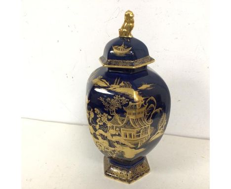 An Edwardian Carltonware lidded jar, with blue ground and gilt Chinese inspired decoration, with lion dog finial and stamped 