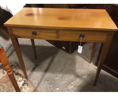 A Georgian style mahogany writing table with inlaid top, fitted two frieze drawers, both marked Brian &amp; Walsh on tapering