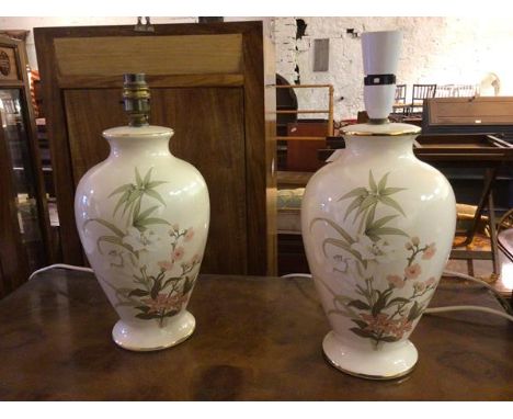 A pair of St Michael ceramic baluster table lamps with foliate decoration (34cm to top of lampholder)