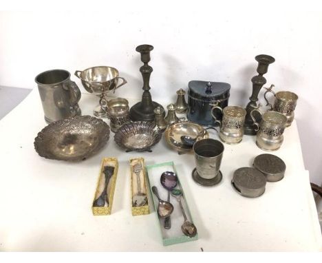 An assortment of Epns and metalware including dishes, pepperettes, trophy, a pair of pewter candlesticks, a pewter mug, two e