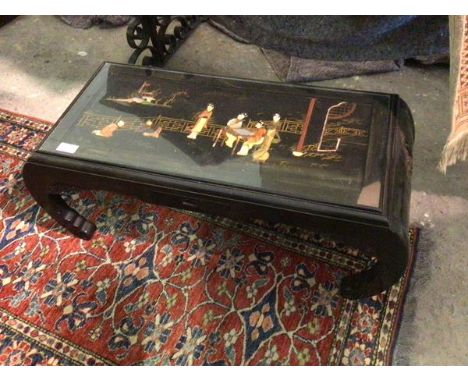 A Chinese hardwood low table, the top with scene depicting Figures on a Verandah, the decoration formed of polished hardstone