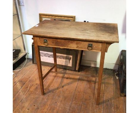 An Arts &amp; Crafts style side table, fitted single frieze drawer with ring handles, on tapering square supports united by H