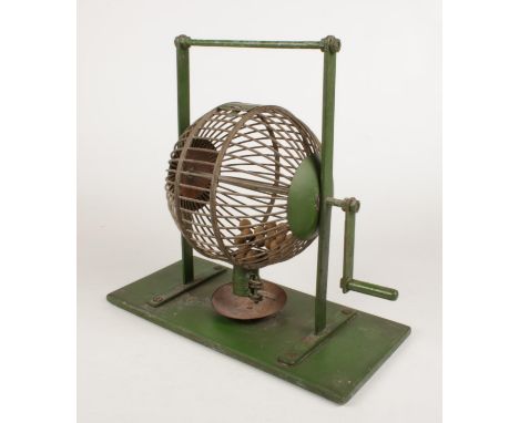 A vintage metal Bingo machine, with a quantity of wooden balls. (Height approximately 35cm).  
