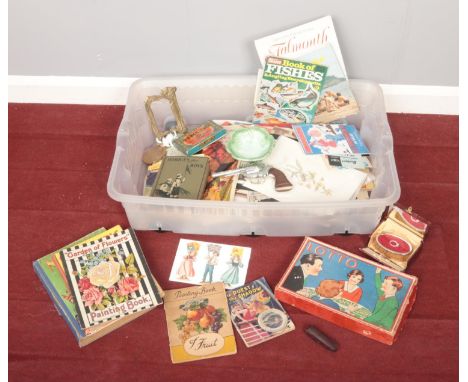 A box of miscellaneous. Includes vintage games, ephemera, toy gun, compact etc.  