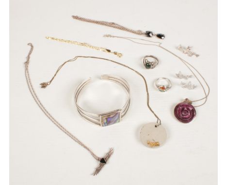 A quantity of assorted silver jewellery. Including abalone shell bangle, pendants on chain, earrings, dress rings, etc.  