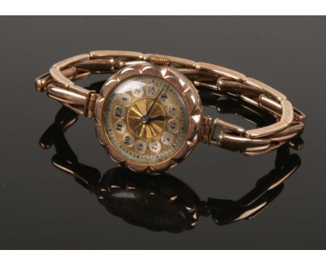 A ladies 9ct gold manual wristwatch on 9ct gold expanding strap. Movement stamped Bonnet &amp; Co. (18.62g gross weight).  Ru
