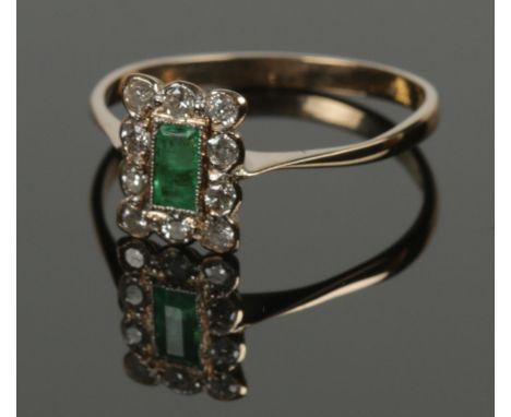 An art deco 18ct gold &amp; platinum emerald and diamond cluster ring. Size P.  