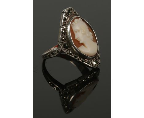 A 9ct gold and silver marcasite cameo ring. Size  