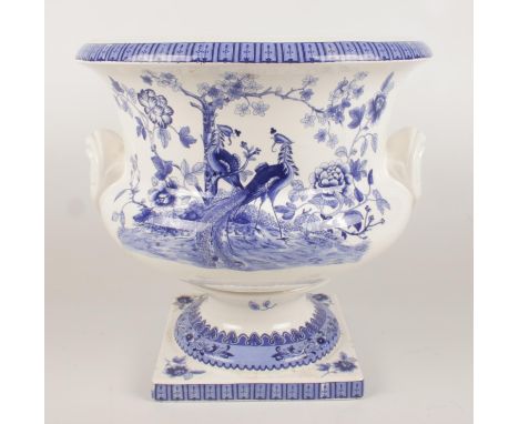 A large ceramic blue &amp; white planter with transfer print decoration depicting peacocks and flowers. (36cm tall)  