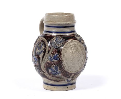 Westerwald stoneware krug circa 1700, salt-glazed stoneware, decorated with flowers and an applied portrait medallion of King