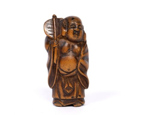 Carved wood netsuke Japanese, Meiji, in the form of Buddha figure holding a palm leaf
