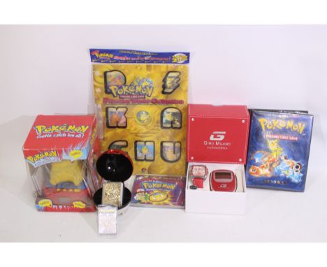 Pokemon - A mixed lot of Pokemon themed cards, games and novelty items plus a quartz watch. Lot includes a Pokemon Trading Ca