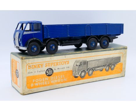 Dinky - A boxed Foden Flat Truck with tailboard in the early colour scheme of dark blue cab, back and wheels with silver side