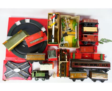 Hornby - Bassett Lowke - A mixed lot of boxed and unboxed O gauge rolling stock and accessories. Lot includes Lot includes a 