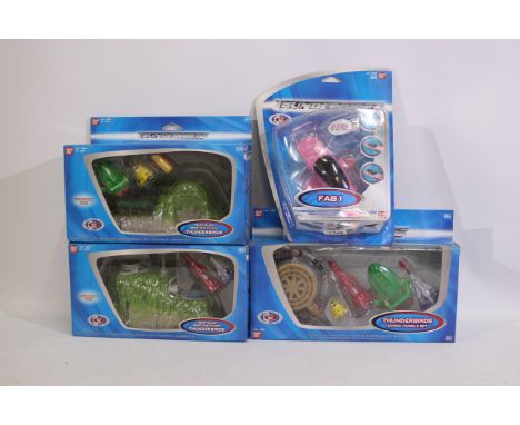 Bandai - Four boxed Thunderbird themed items from Bandai. Lot consists of Bandai #9502 FAB1; #95016 Tracy Island Secret Base 