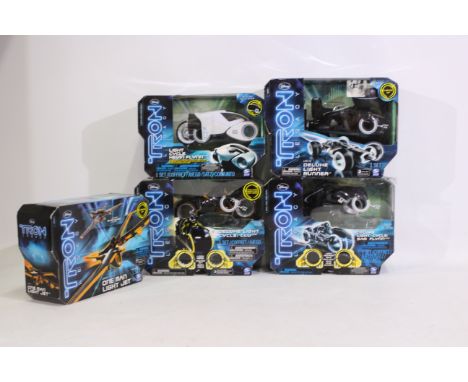 Spin Master - Disney - Five boxed 'Tron Legacy' action figure vehicles. Lot includes Deluxe Light Cycle 'Clu'; One Man Light 