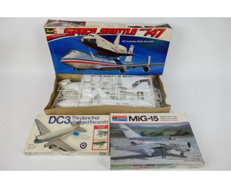 Revell - Entex - Monogram - Three boxed plastic model aircraft kits. Lot consists of Revell H1771:144 scale Space Shuttle 'En