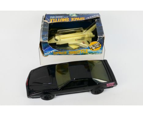 Ertl - two Ertl vintage diecast vehicles. Lot includes a boxed Ertl #1514 Space Shuttle - appears Mint in a Poor window box; 