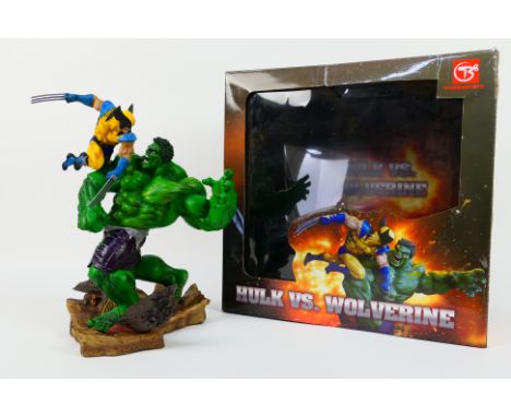 Tianbaotoys - Marvel - A boxed Hulk vs. Wolverine statue which is approximately 12 inches tall. The model appears in Mint con