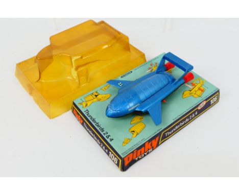 Dinky Toys - A boxed Dinky Toys #106 Thunderbirds 2&4. The model in metallic blue with black underside, red legs with red and