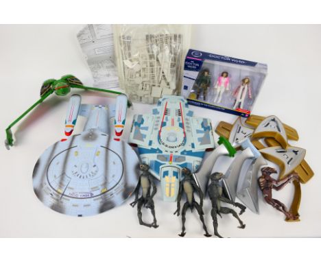 AMT / Ertl -  A mixed lot of mainly unboxed action figures, vehicles and a plastic model kit. Lot includes an unboxed vintage