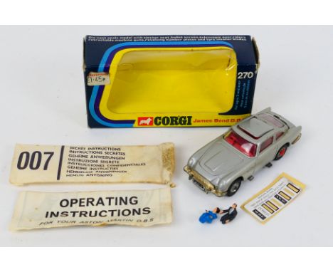 Corgi Toys - A boxed Corgi #270 James Bond Aston Martin DB5. The model in metallic silver has some tarnishing to bumpers, has