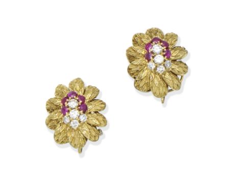 A pair of ruby and diamond earclipsEach formed as a stylised textured flowerhead set with a cluster of circular-cut rubies an