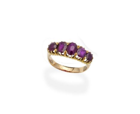 A ruby five-stone ringSet with a graduated series of oval-cut rubies, ring size approx. M½