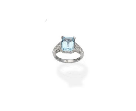 An aquamarine and diamond ringThe step-cut aquamarine between brilliant-cut diamond shoulders, the gallery similarly-set, dia