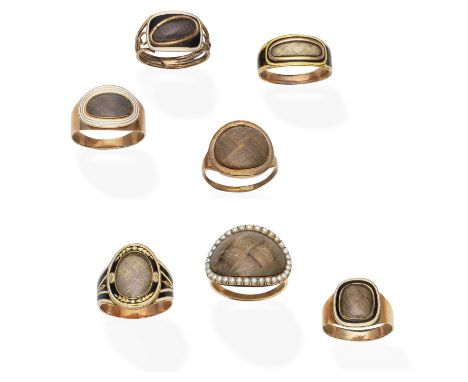 A collection of enamel, seed pearl and hairwork rings, circa 1794-1812Comprising: seven rings, each with a central hairwork p