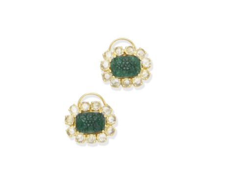 A pair of emerald and diamond earrings, by VeschettiEach cushion-shaped emerald carved to depict a flower head, within a surr