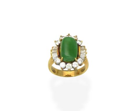 A jade and diamond ringThe oval jade cabochon within a brilliant and tapered baguette-cut diamond surround, diamonds approx. 