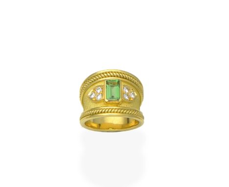 A garnet and diamond ring, by De Vroomen, 1996The step-cut tsavorite garnet to a textured ground, between brilliant-cut diamo