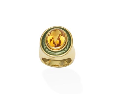 An enamel and citrine ring, by De Vroomen, 1998The oval citrine cabochon within a green guilloché enamel surround, in an 18 c