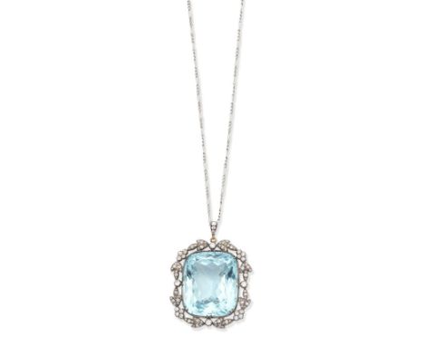 An aquamarine and diamond brooch/pendant, circa 1900The large cushion-shaped aquamarine within a foliate surround set with ol