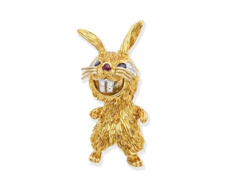 A novelty brooch, by Kutchinsky, 1975Designed as a rabbit, the eyes set with pear-shaped sapphires and single-cut diamonds, w