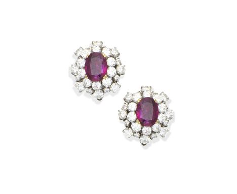 A pair of ruby and diamond cluster earringsEach oval-cut ruby within a tiered surround of brilliant-cut diamonds, diamonds ap