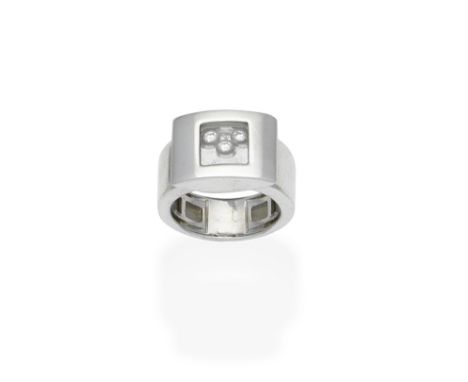 A 'Happy Diamonds' ring, by ChopardSet to the front with a glazed compartment revealing three 'floating' brilliant-cut diamon