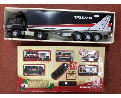 A Made in Finland 1:25 Scale Plastic Model Volvo FL10 Intercooler (part boxed) together with a Toy State Northpole Holiday Ex