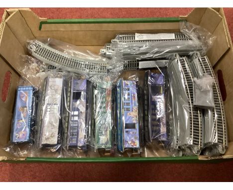 Six Bachmann Hawthorne Village Novelty 0n30 coaches and a quantity of track.