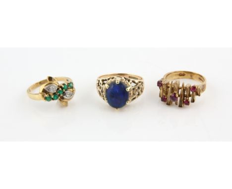 Three gem set rings, one emerald and diamond bow design, ring size N, another abstract 1970's ruby set band, size K and vinta