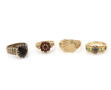 Four vintage gold rings, 1970's single stone garnet ring on abstract pattern band, garnet cluster, opal and peridot, and a si