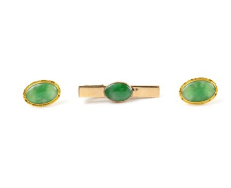 A pair of jade cufflinks, set in fine gold mounts, and a tie clip with jade cabochon .   cufflinks gross weight 7 grams 